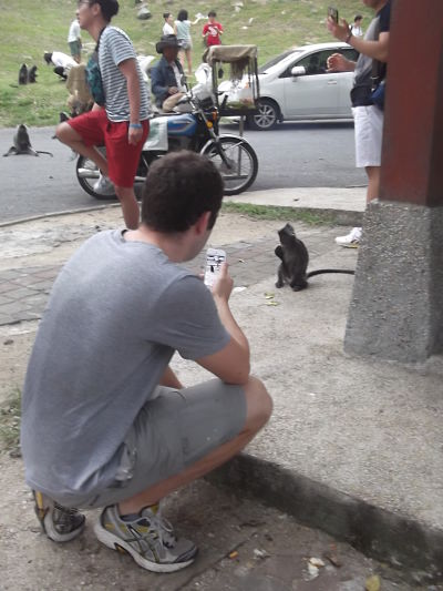 Steve photographing a monkey in Malaysia